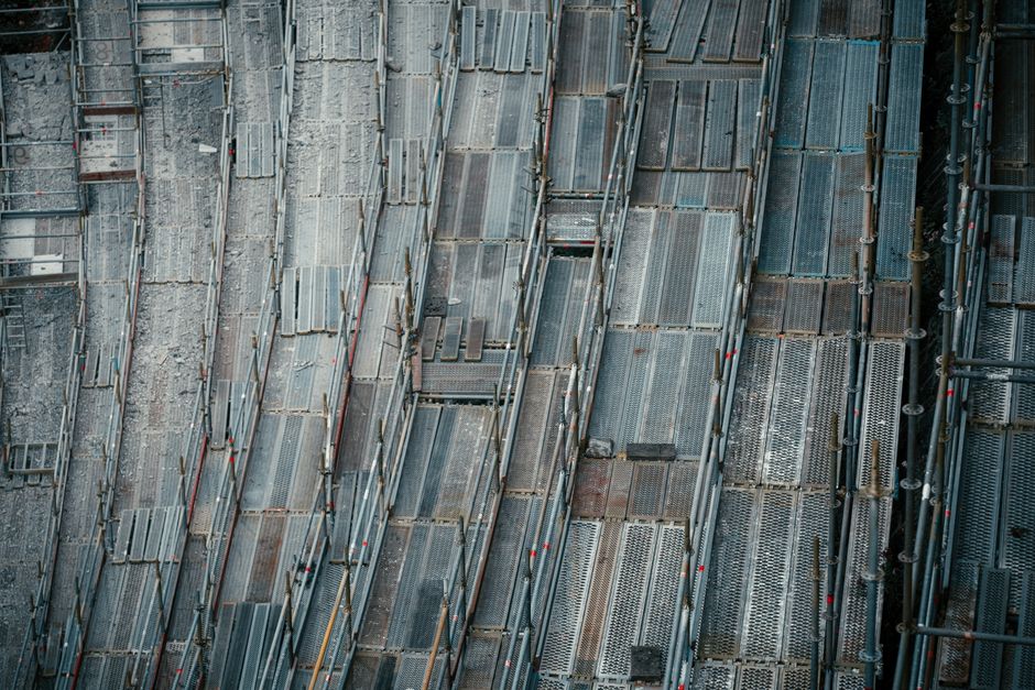 High-angle view of metal scaffolding at a construction site, capturing industrial textures.